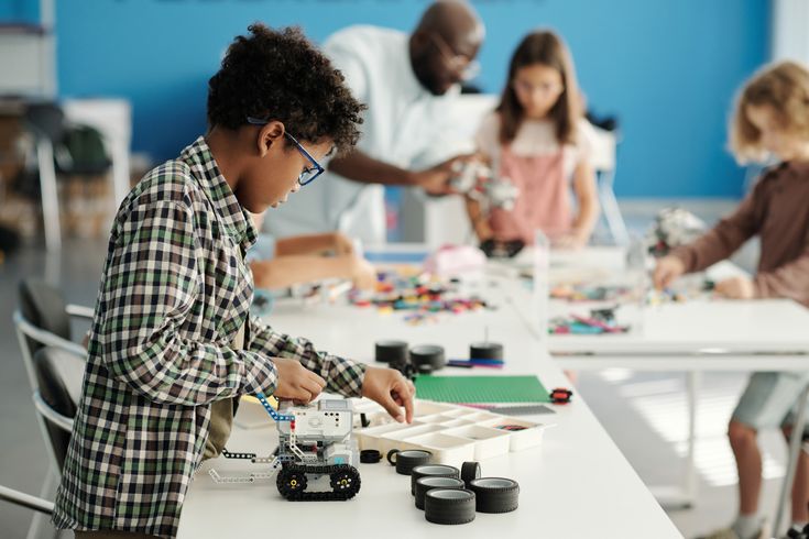 Lycée students working on a robotics project at the East Africa regional finals
